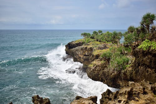 Ocean Waves Crashing on Rocky Shore