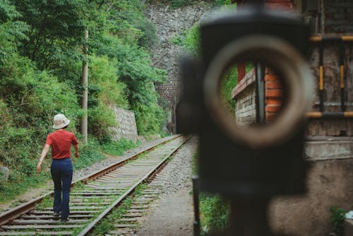 Backview of Person walking on a Railway 