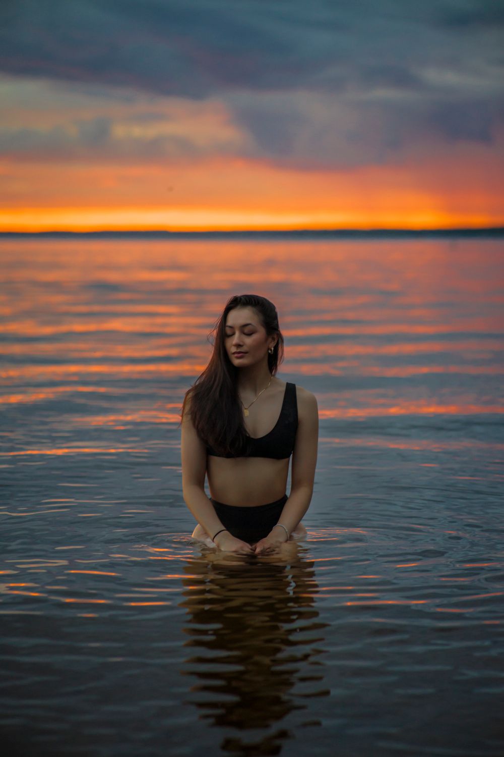 Woman in Water at Sunset · Free Stock Photo