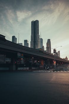 Striking view of New York City skyscrapers against a dramatic sky, showcasing urban architecture.