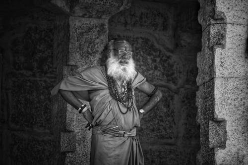 Grayscale Photo of an Elderly Man wearing Traditional Wear 