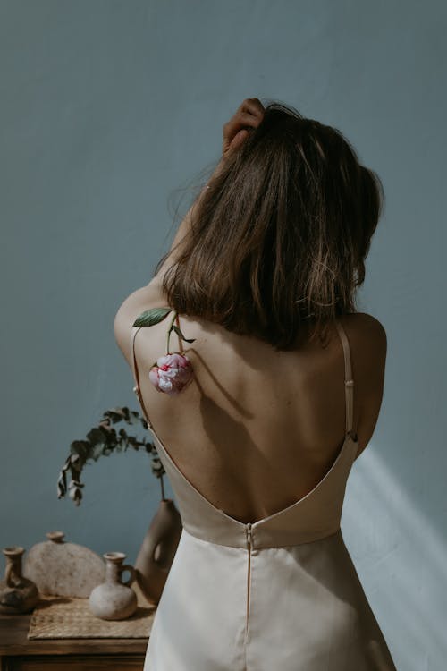Free Woman Wearing a Simple Dress with an Open Back  Stock Photo