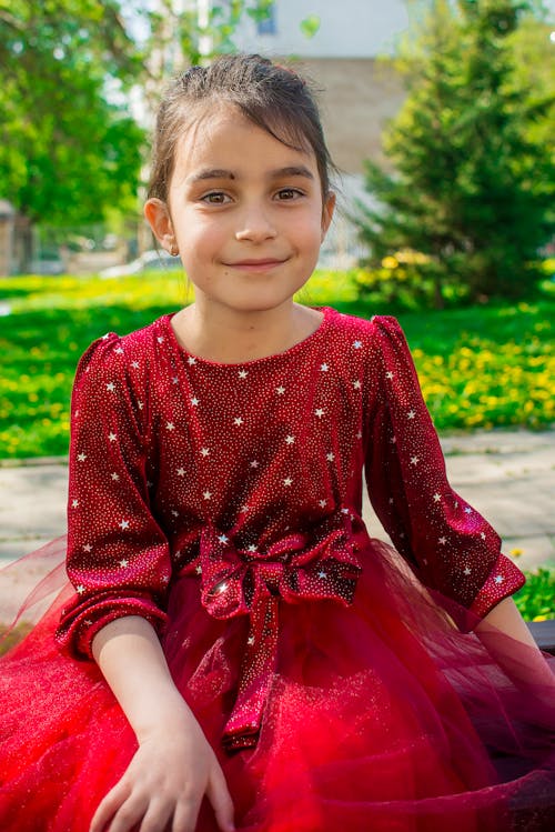 Close-up Photo of a Pretty Girl in Red Dress