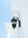 Black Metal Bird Cage on White Concrete Wall