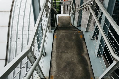 Free Explore modern urban architecture with this perspective of an industrial staircase and steel railings. Stock Photo