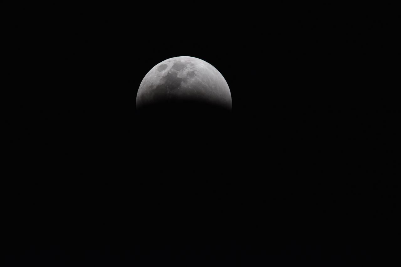 dramatic view of a partial lunar eclipse showcasing the moon s shadowe