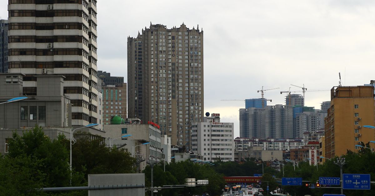 Cars on Road Near High Rise Buildings · Free Stock Photo