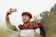A Young Man Taking Selfie using a Smartphone