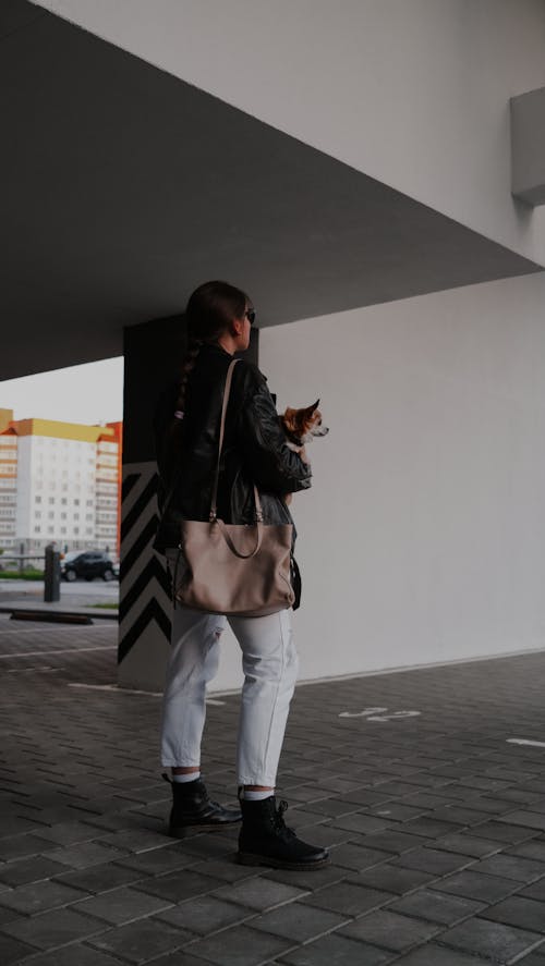 Beautiful Woman in Black Leather Jacket and Wash Jeans 