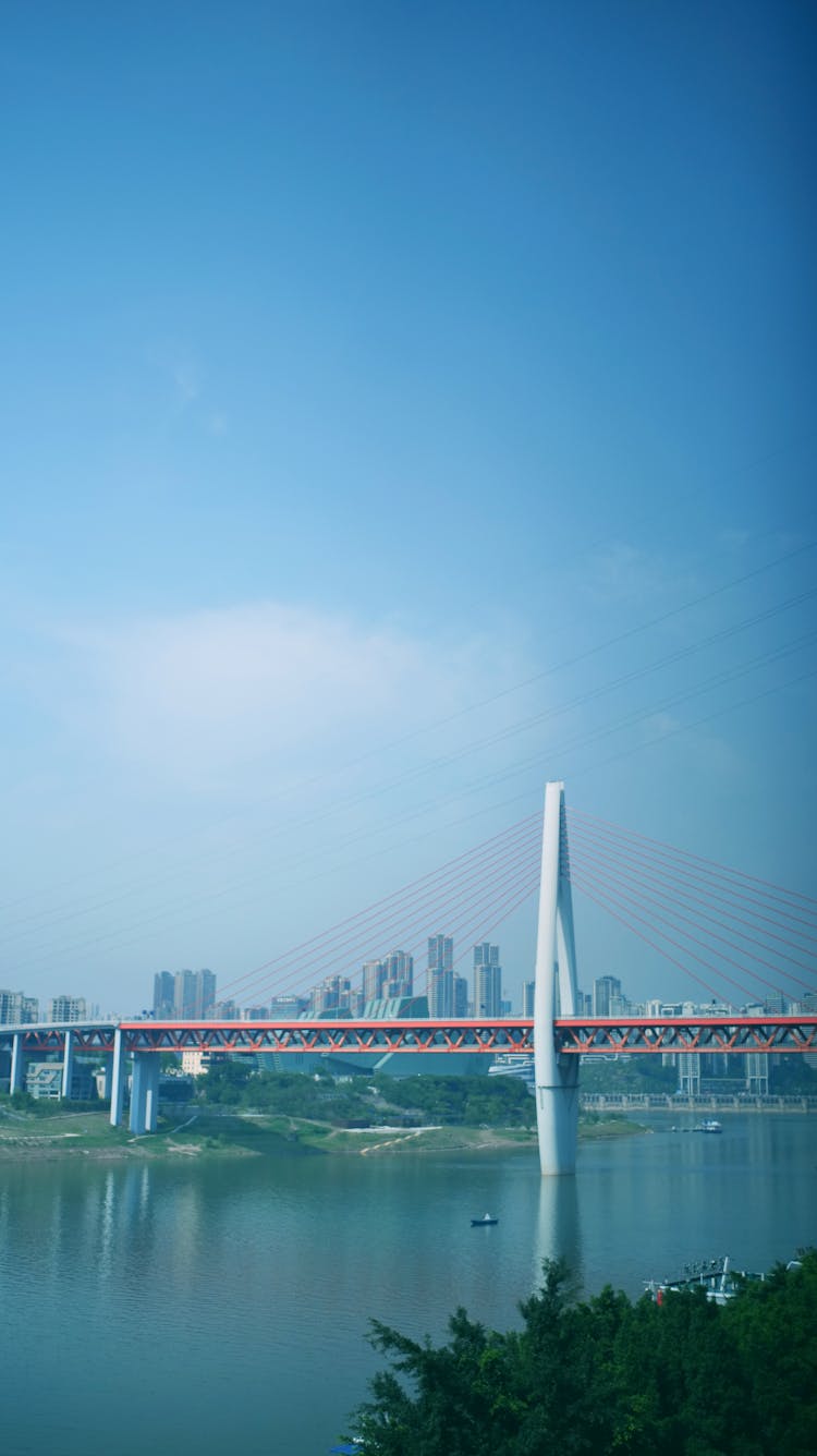 View Of The Dongshuimen Bridge Across The Yangtze River In China Under Blue Sky