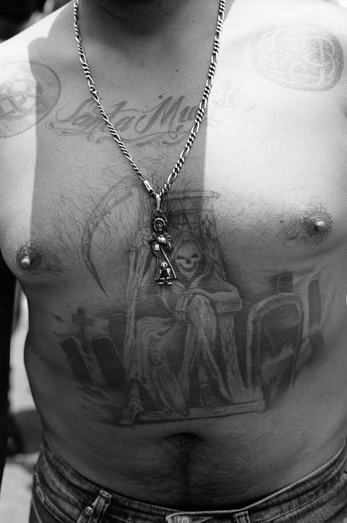 Grayscale Photo of Shirtless Tattooed Man 