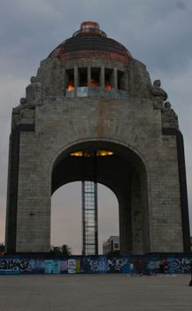 Dramatic view of Mexico City's Monumento a la Revolución, showcasing its architectural grandeur.