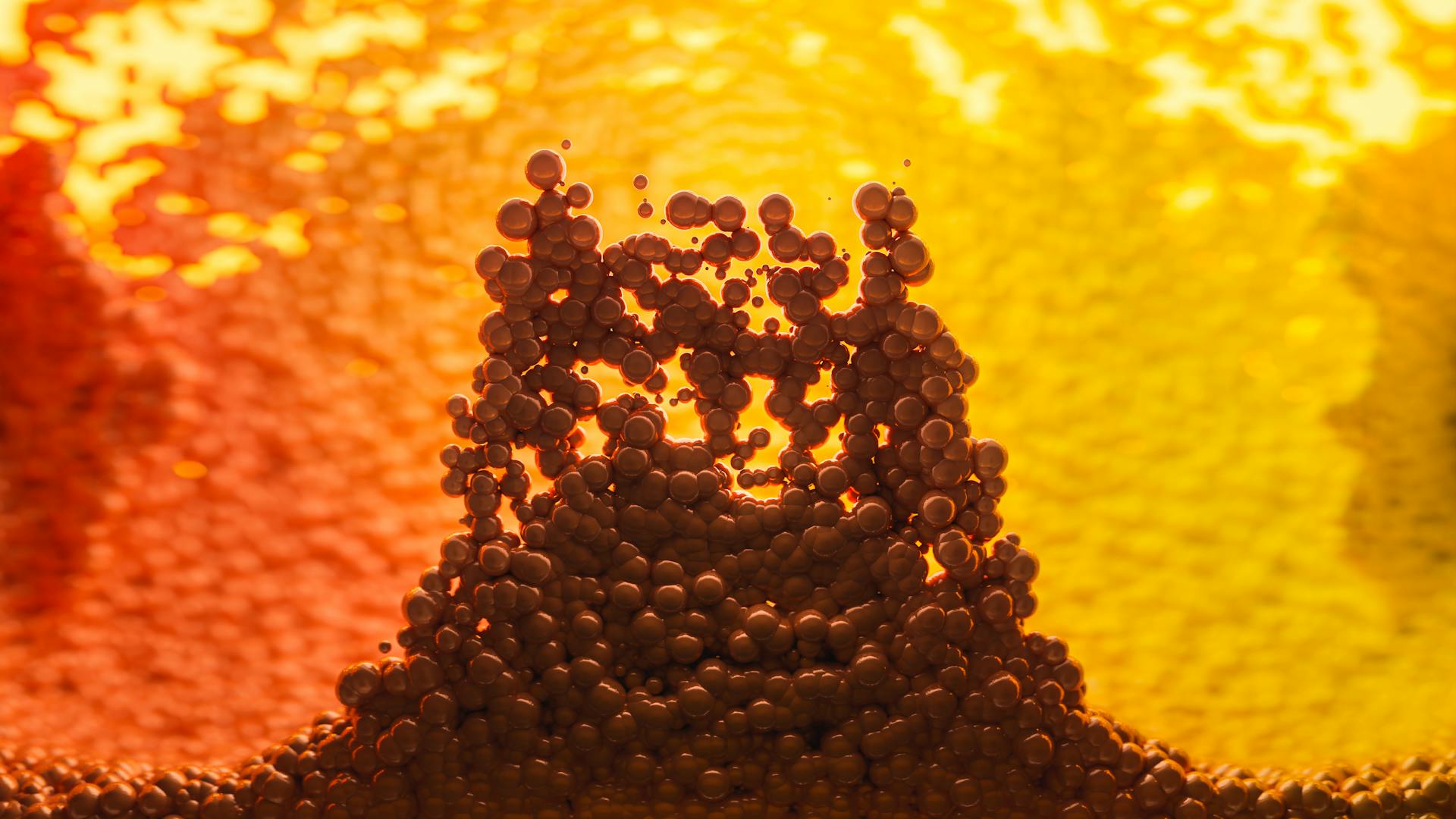 Dynamic abstract 3D render featuring molecules with vibrant yellow and orange colors, suggesting energy and motion.