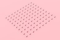 Tiny Items on a Pink Surface