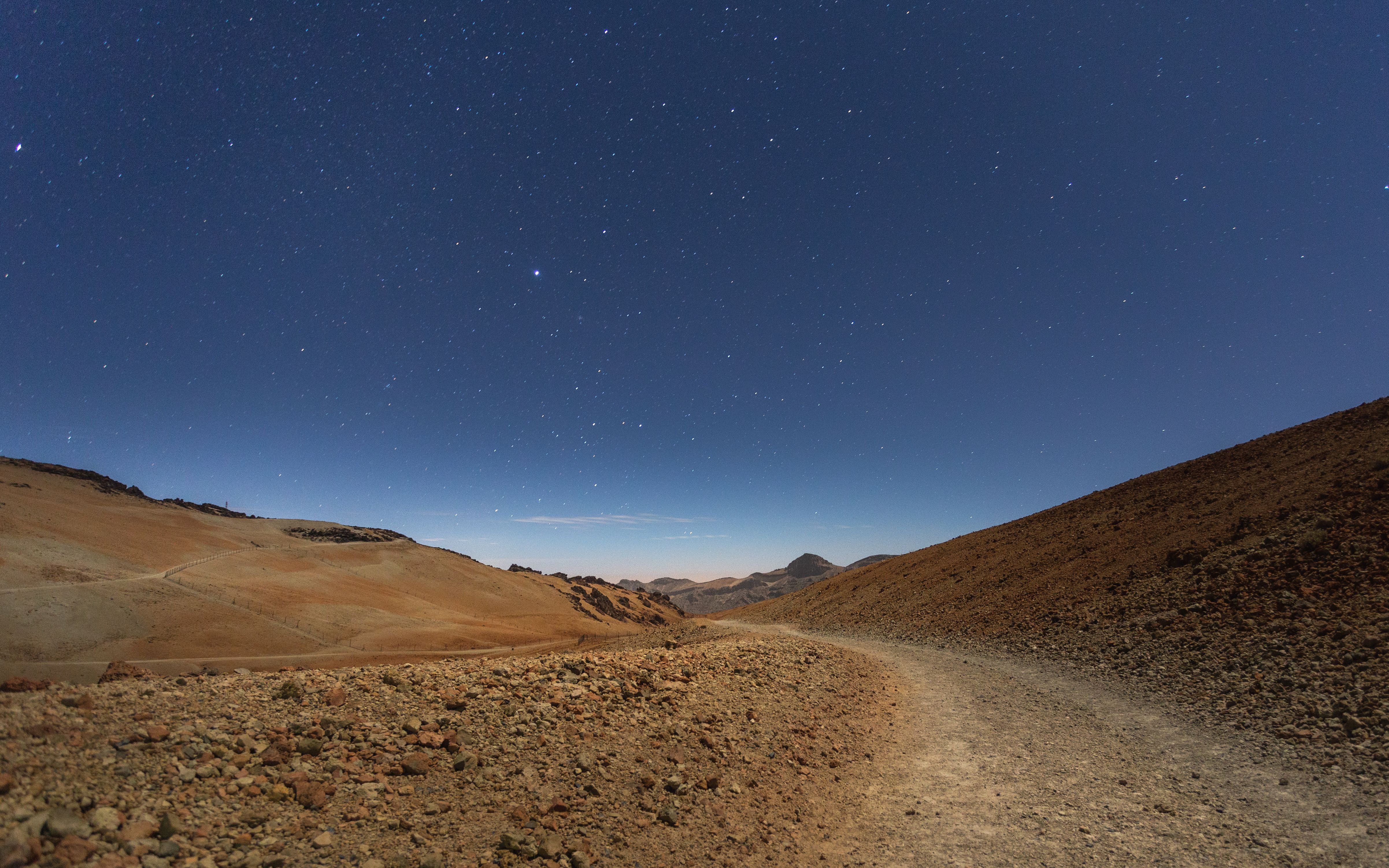 Explore the starry skies and barren landscapes of Teide National Park at night.