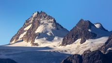 Snow Covered Mountain Near Body of Water
