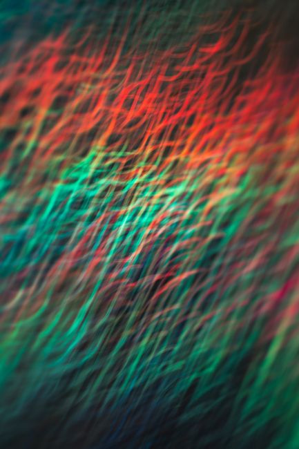Dynamic abstract image featuring vibrant lines and motion blur in a multicolor palette.