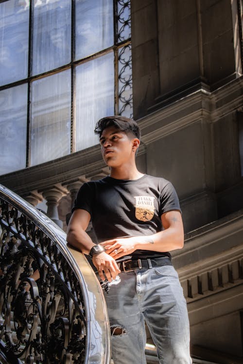 Man in Black Crew Neck T-shirt Standing on Staircase