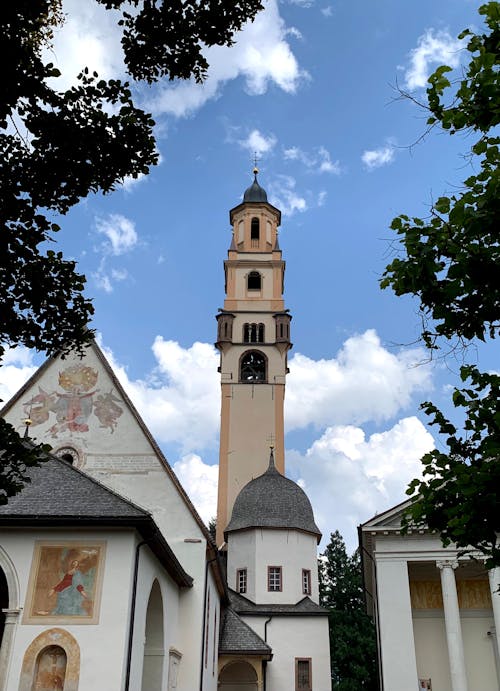 Free Church and Bell Tower Under Blue Sky with White Clouds Stock Photo