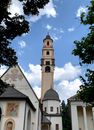 Church and Bell Tower Under Blue Sky with White Clouds