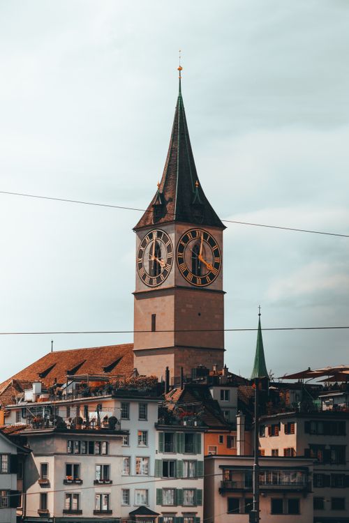 Free Gothic-style St. Peter's Church tower with clock face in Zurich, Switzerland. Stock Photo