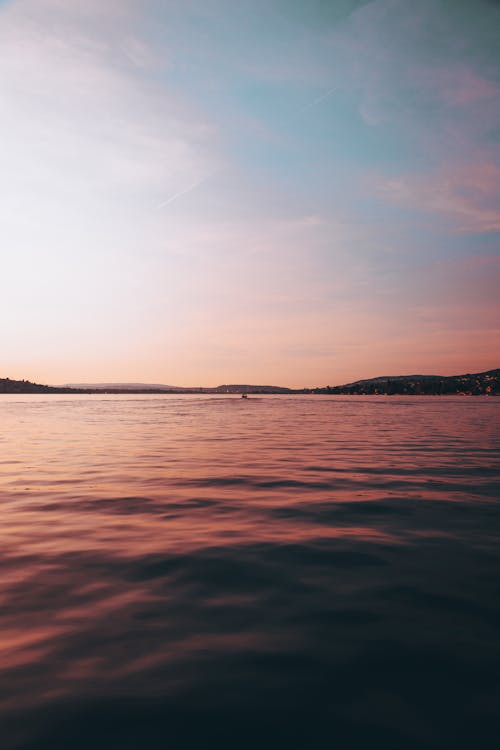 akşam karanlığı, barışçıl, deniz içeren Ücretsiz stok fotoğraf