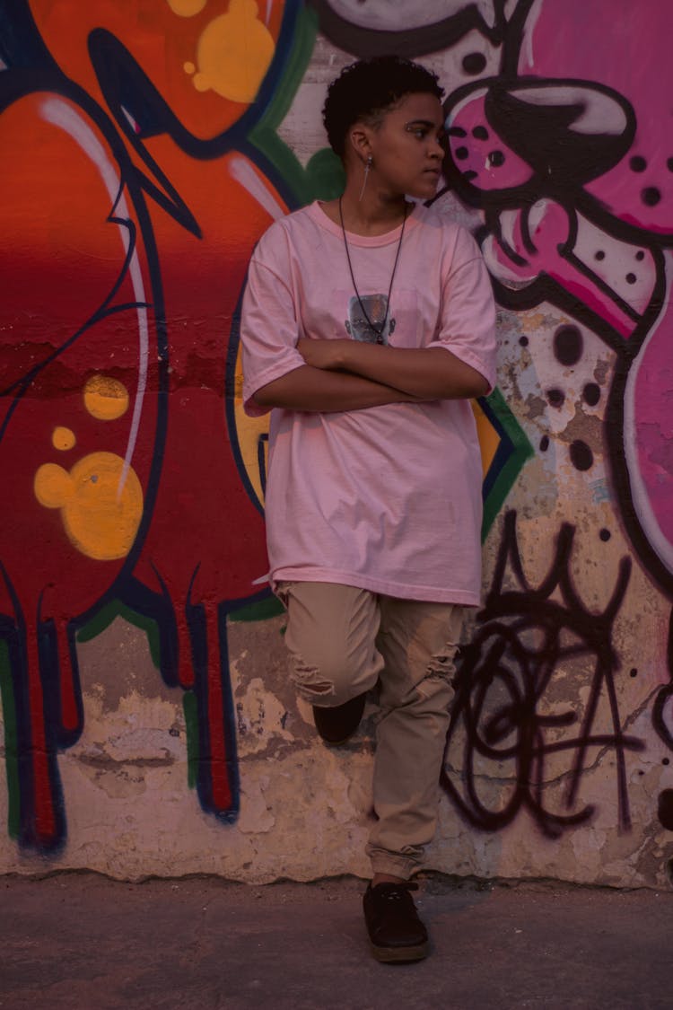 Girl In Casual Clothes Near Graffiti Wall