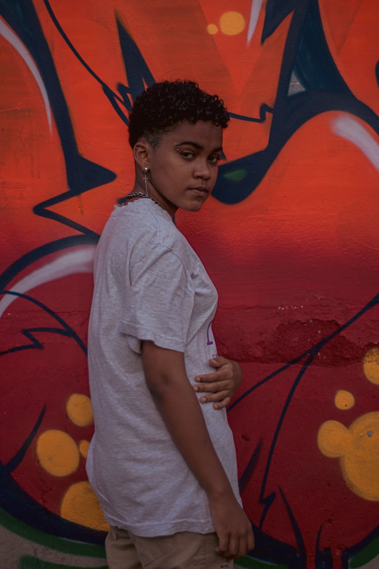 Girl In Casual Outfit Near Graffiti Wall