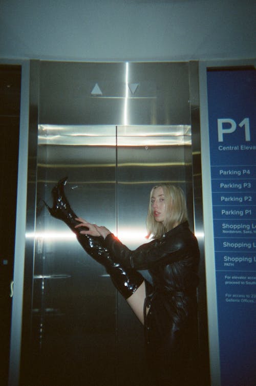 Alluring Woman in Black Leather Jacket and Boots 