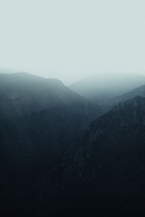 Free A serene view of misty mountain ranges in Tlamaya, Mexico, showcasing the beauty of nature at dawn. Stock Photo