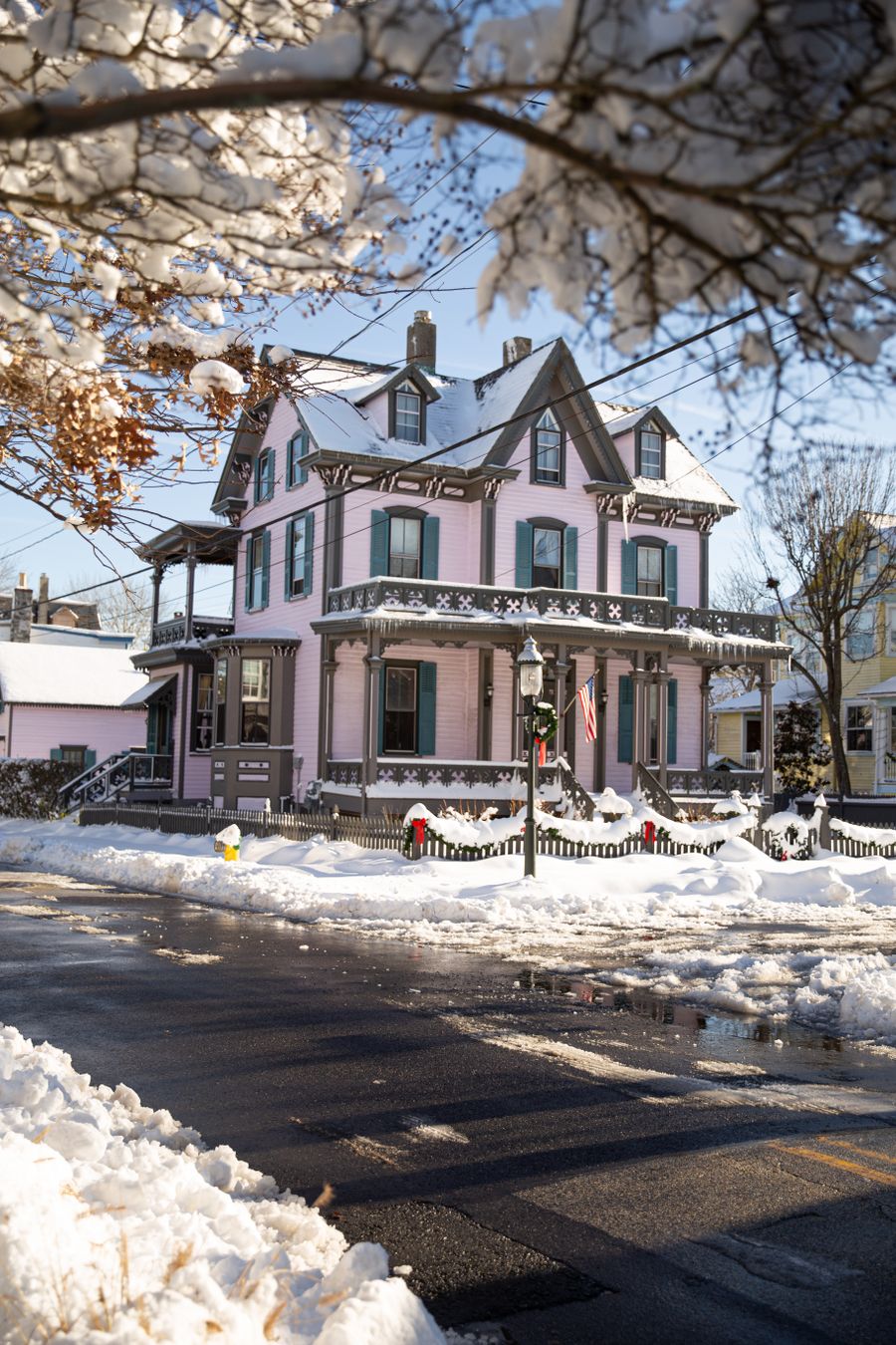 Victorian house in Cape May with ornate trim, in winter