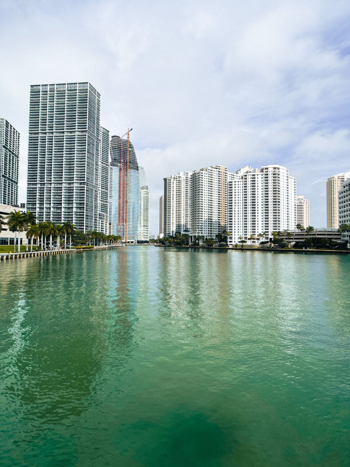 Brickell high-rises rising over the turquoise water of the Miami River near Biscayne Bay