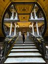 Woman in Black Dress Walking on Staircase