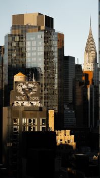 Stunning view of New York City skyline featuring the iconic Chrysler Building at sunset.