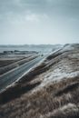 Brown Field Near Body of Water