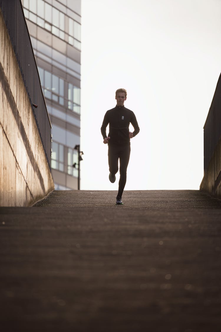 Photo Of A Jogging Man At Sunset