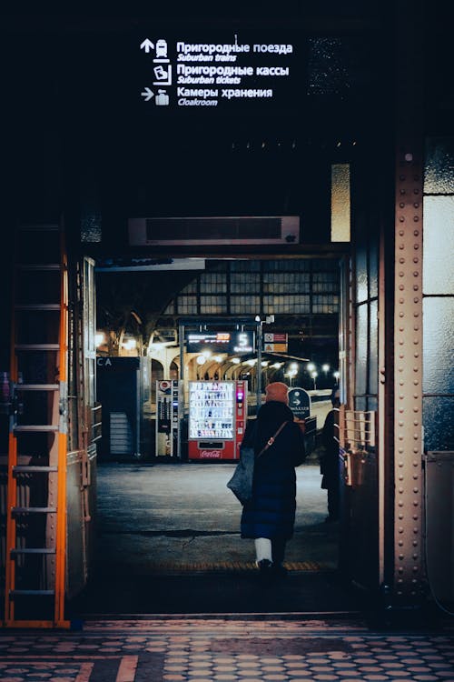 A Person Walking Inside A Subway Station