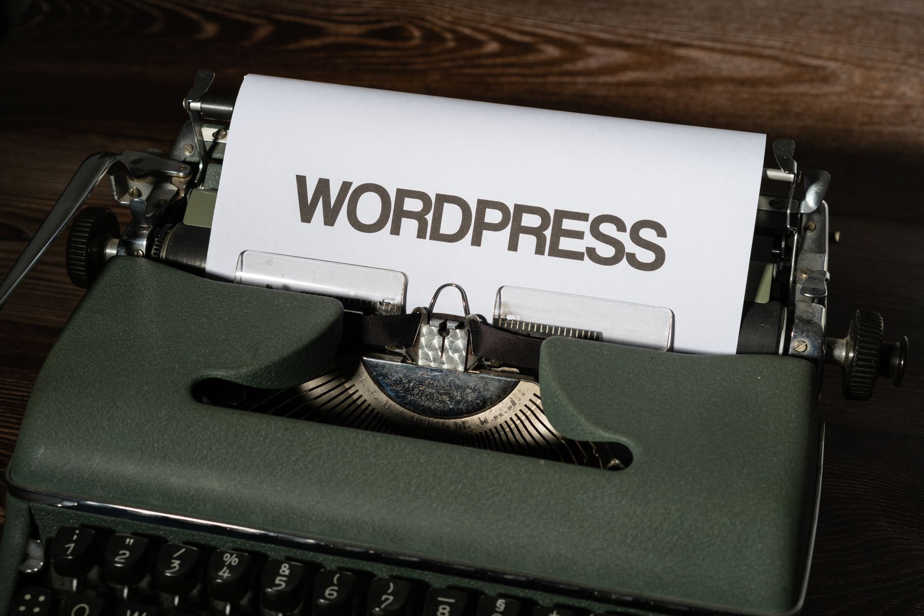 optimasi Core Web Vitals WordPress - Close-up of a vintage typewriter with 'WordPress' typed on white paper.