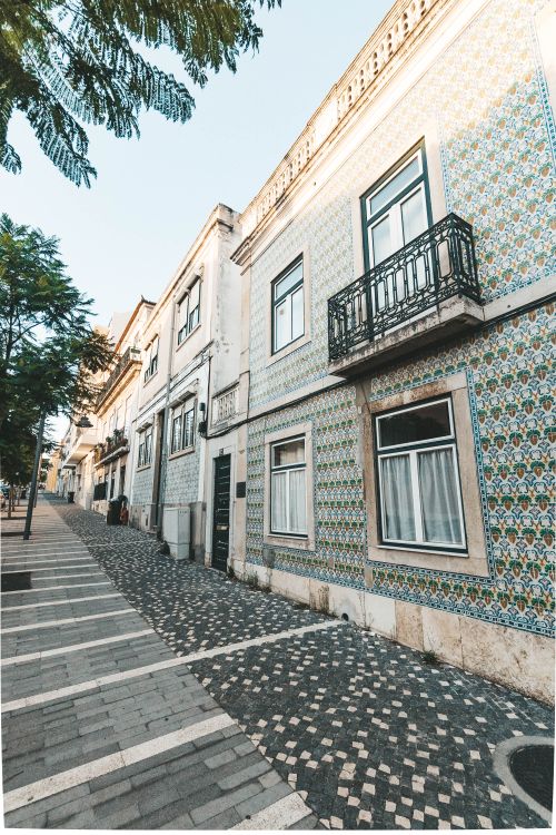 Free Explore the beautiful tiled facades in Lisbon's charming old town, featuring traditional Portuguese architectural design. Stock Photo