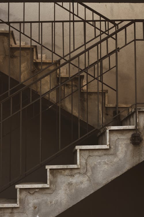 Concrete Staircase With Black Metal Railings