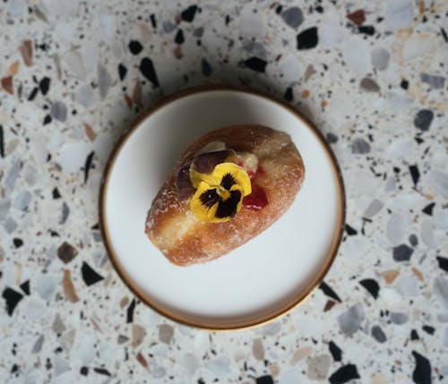 Doughnut with Strawberry Filling on Ceramic Plate