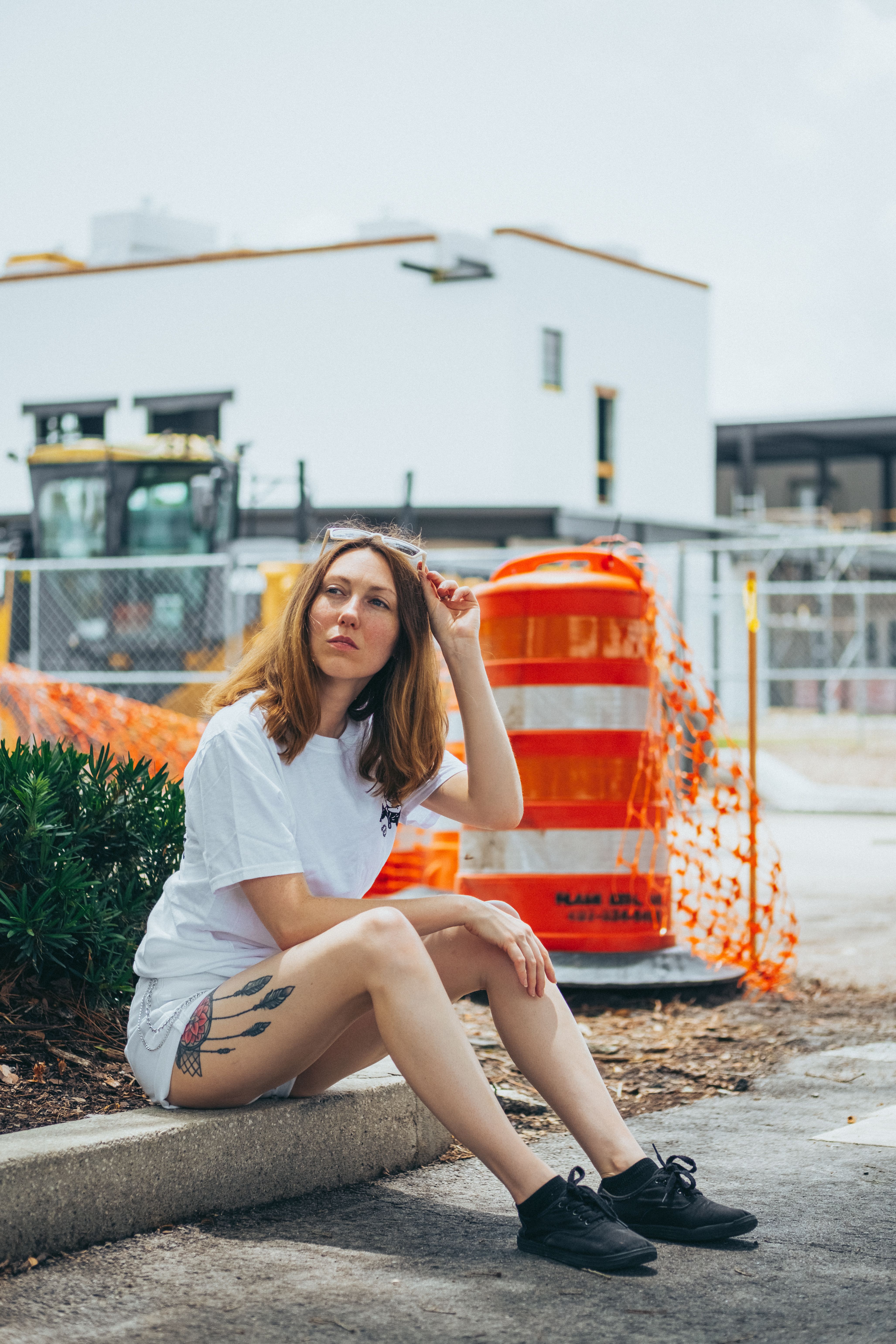 Stylish Woman sitting on a Gutter · Free Stock Photo