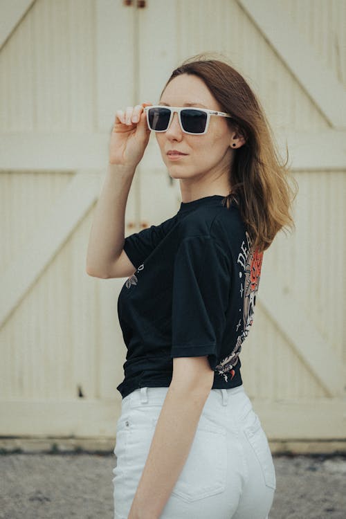 Stylish Woman in Black Shirt and Sunglasses