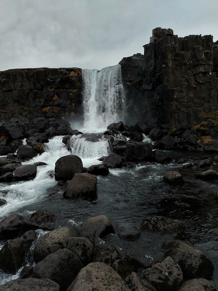 Water Falls On Rock Formations 