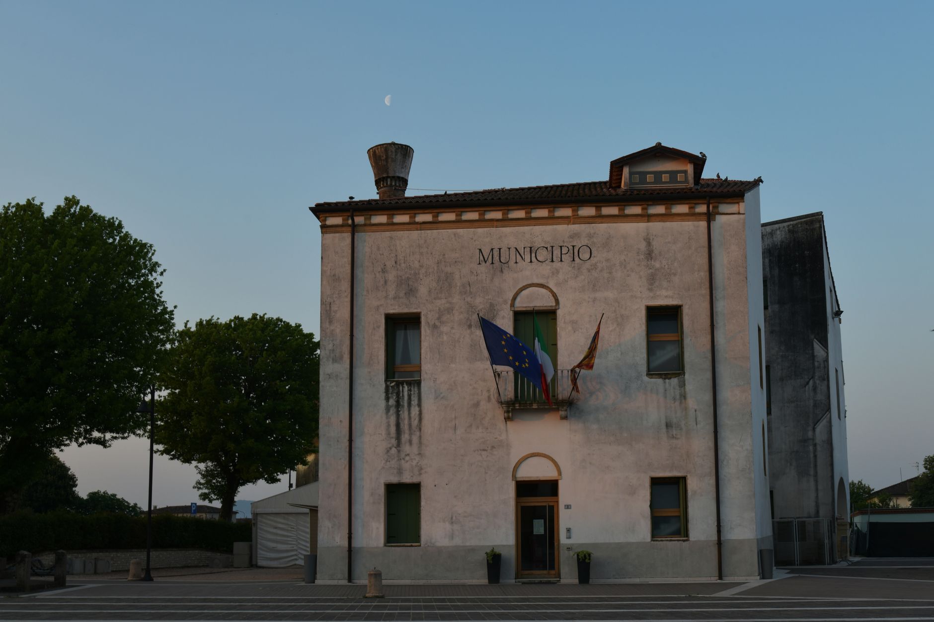 Capture of a weathered municipio building in Veneto, Italy during evening light.