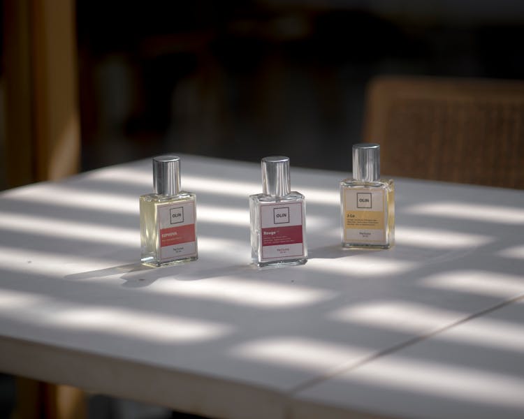 Perfume Bottles On White Table