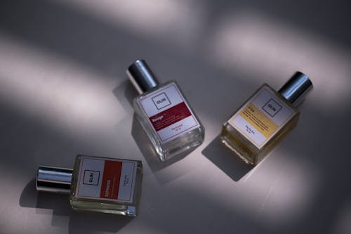  Olin Perfume Bottles on Gray Surface