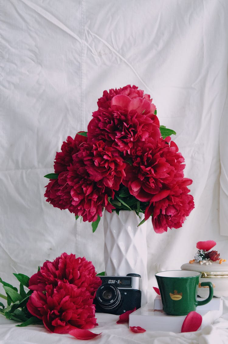 Bunch Of Dark Pink Peonies In A Vase