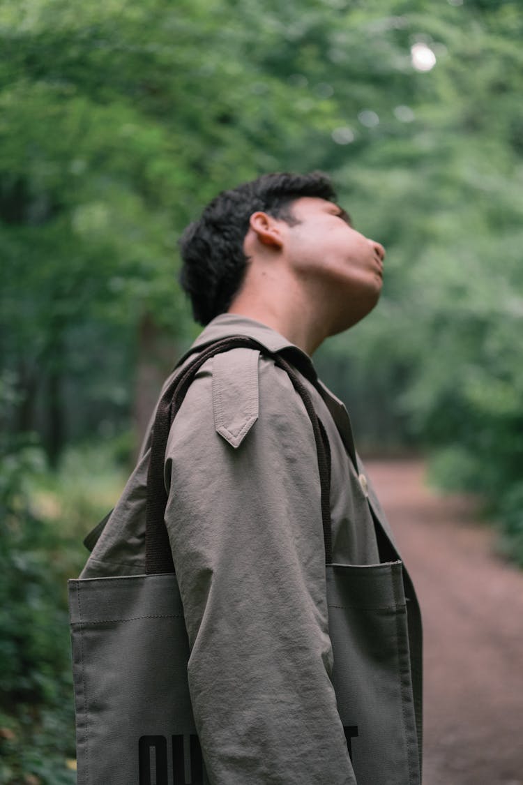 Man With Bag In Forest