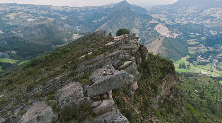 People On Top Of A Rock Mountain